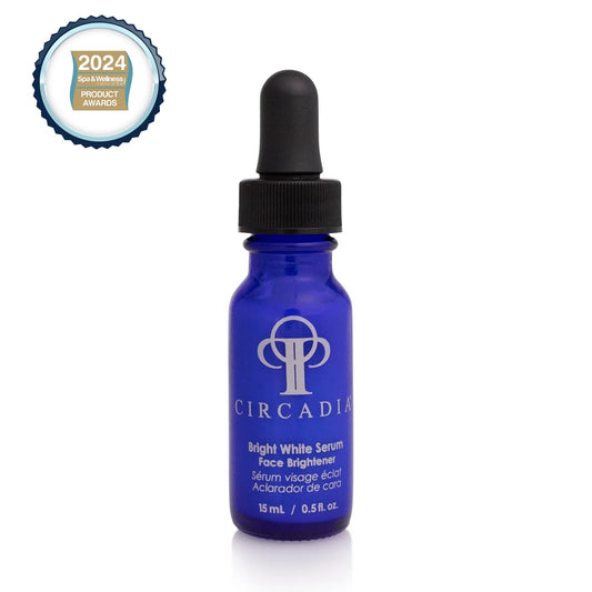 Bright White Serum in a blue glass bottle with a dropper, showcasing its skin-brightening properties.