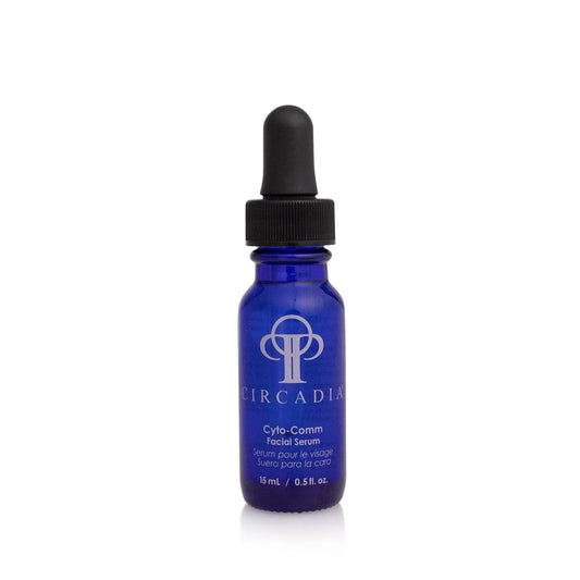 Cyto-Comm Serum in a blue dropper bottle for skin enhancement and firmness.