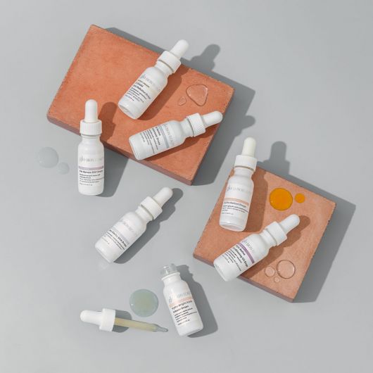The Solutions Serum Set V2 with seven targeted treatment serums in smart dropper format, for personalized skincare solutions.
