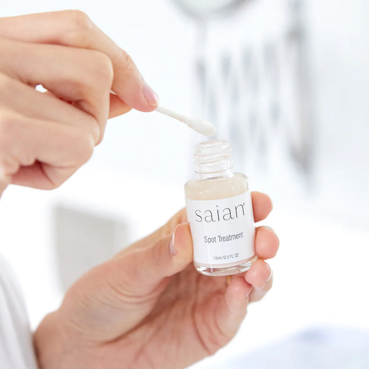 Blemish Spot Treatment by Saian being applied with a cotton swab for targeted blemish care.