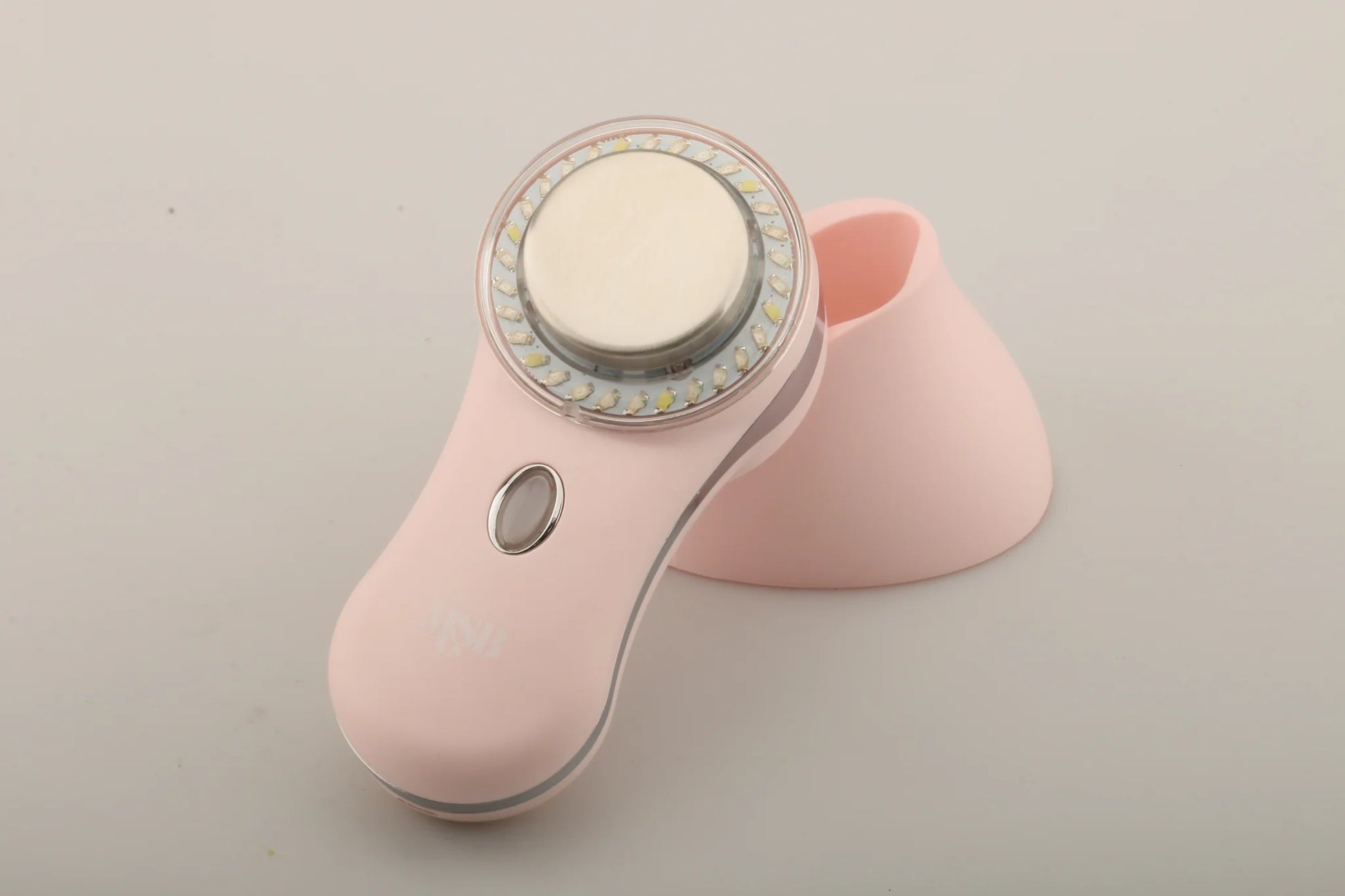 MYSKINBUDDY Boost pink facial device with LED lights and charging dock for skincare treatments.