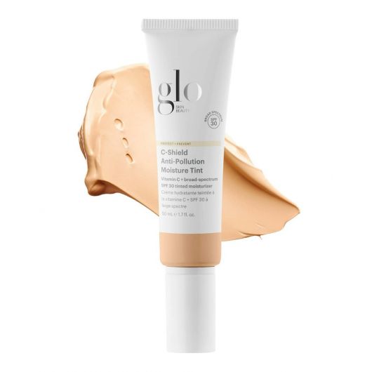 C-Shield Anti-Pollution Moisture Tint SPF 30 tube with beige swatch, 3-in-1 tinted moisturizer for protection, hydration, and radiant finish.