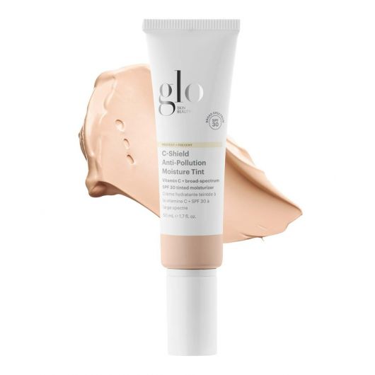 C-Shield Anti-Pollution Moisture Tint SPF 30 tube with swatch showcasing lightweight, hydrating tinted moisturizer for dewy, radiant skin.