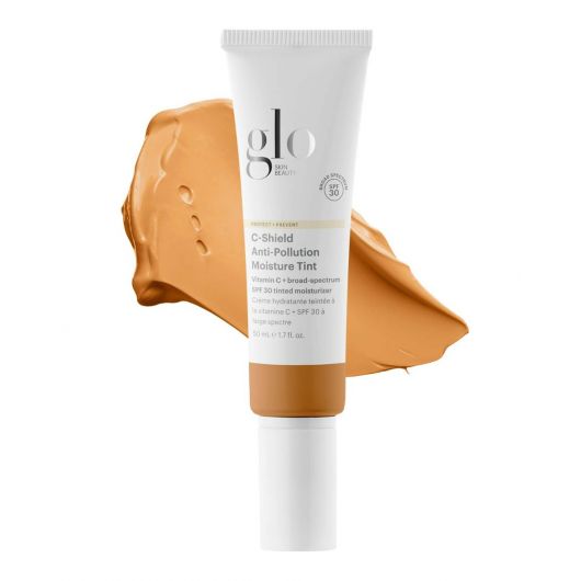 C-Shield Anti-Pollution Moisture Tint SPF 30 tube with a smear of its tinted moisturizer showcasing its color and texture.