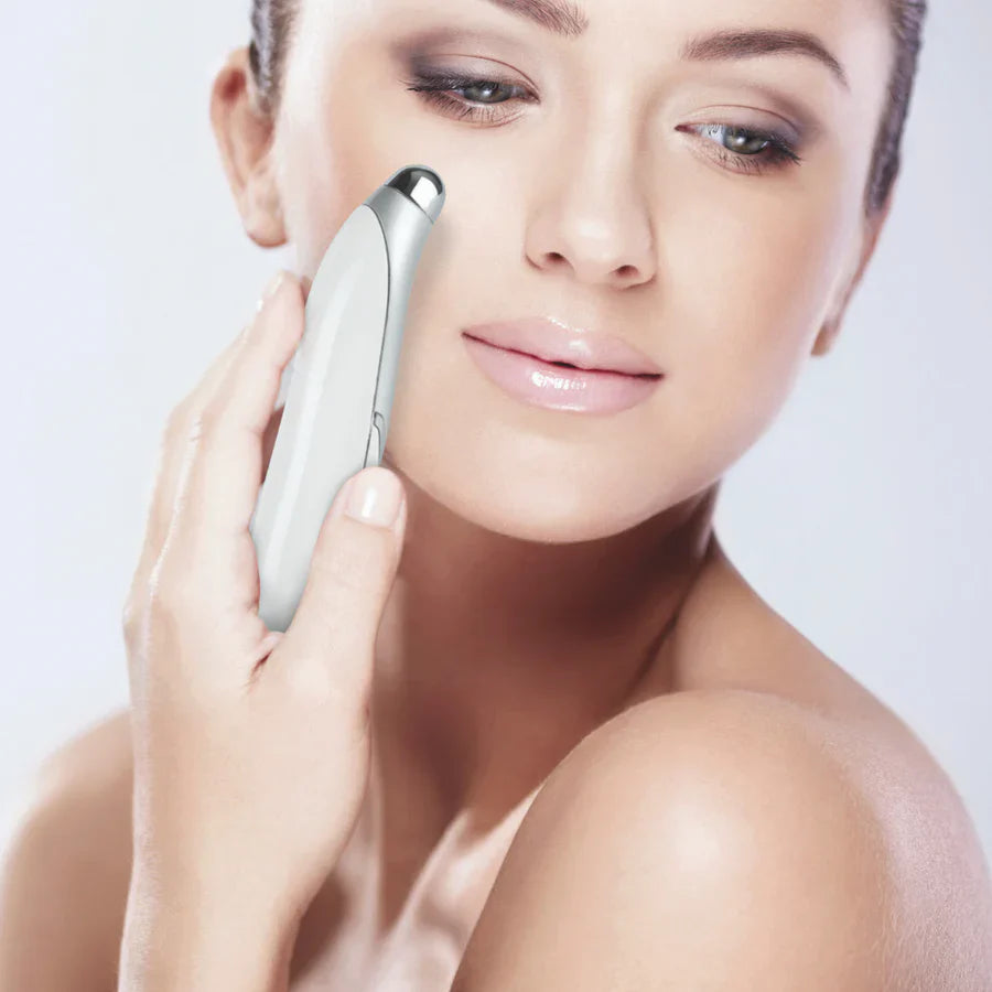 Woman using eye contour serum with MBK Eye Rejuvenator on her face for reduced puffiness and dark circles.