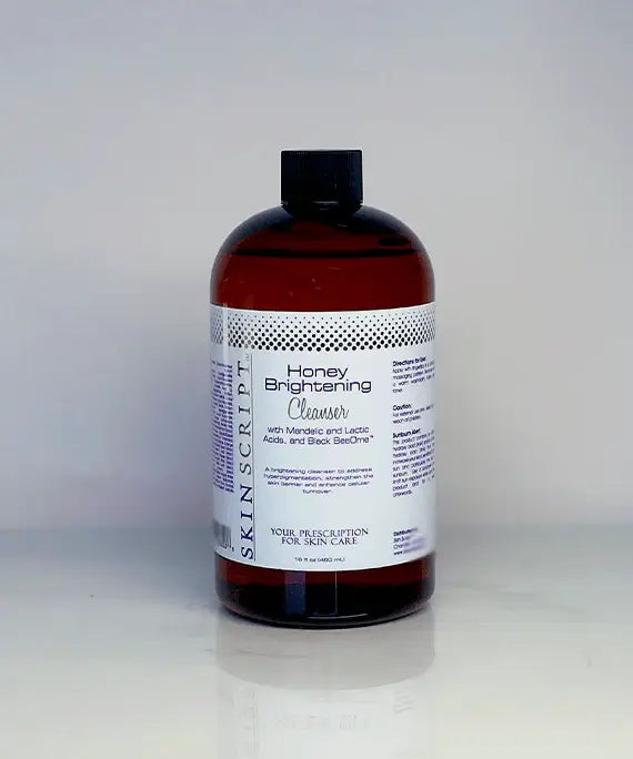 Honey Brightening Cleanser bottle with mandelic and lactic acid, Black BeeOme™, and Arizona mesquite honey for brightening and hydrating skin.