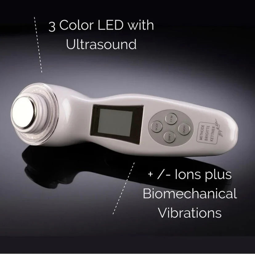 The Wave skincare device with 3 color LED, ultrasound, ions, and biomechanical vibrations for toning and anti-aging.