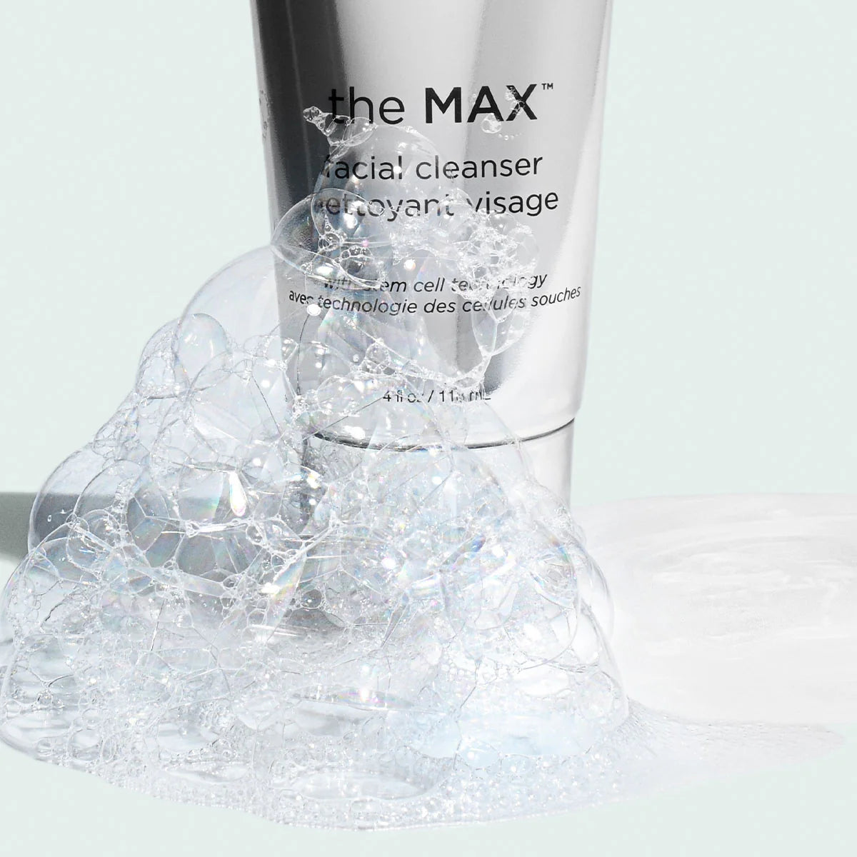The MAX™ Facial Cleanser with silky bubbles and luxurious formula on a light background.
