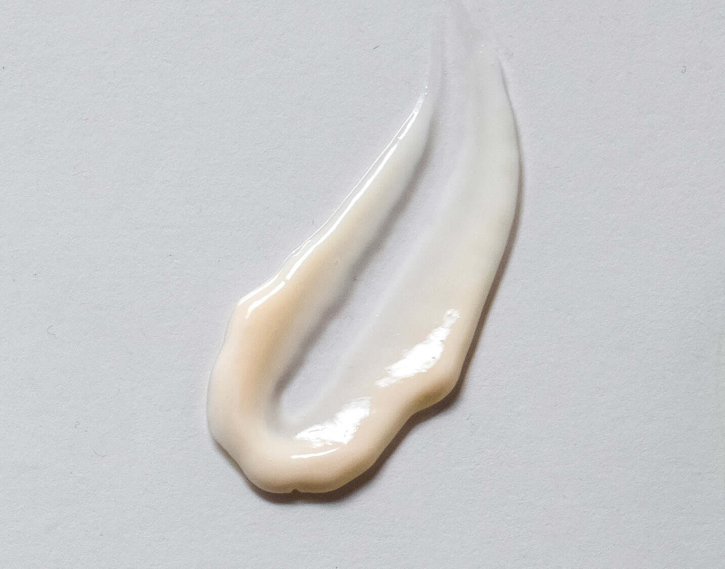 Close-up texture of Tri-Peptide Eye Cream showing creamy smooth application for under-eye revitalization.