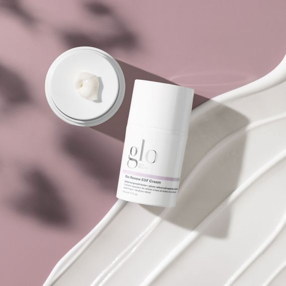 Bio-Renew EGF Cream by glo skin beauty on a white surface with lid open, showcasing the anti-aging cream texture.