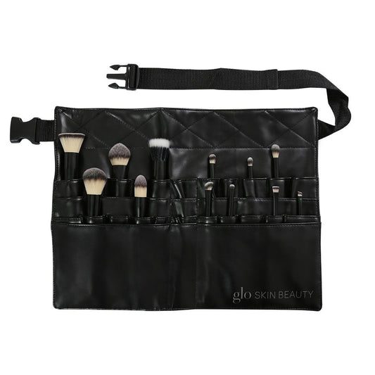 Glo Skin Beauty Brush Belt filled with various makeup brushes, featuring 28 pockets and an adjustable strap in a soft leather-like Polyurethane material.