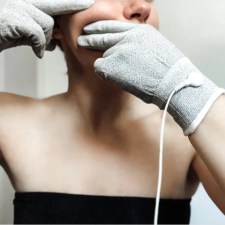 Woman using conductive gloves for MyoLift microcurrent facial treatment