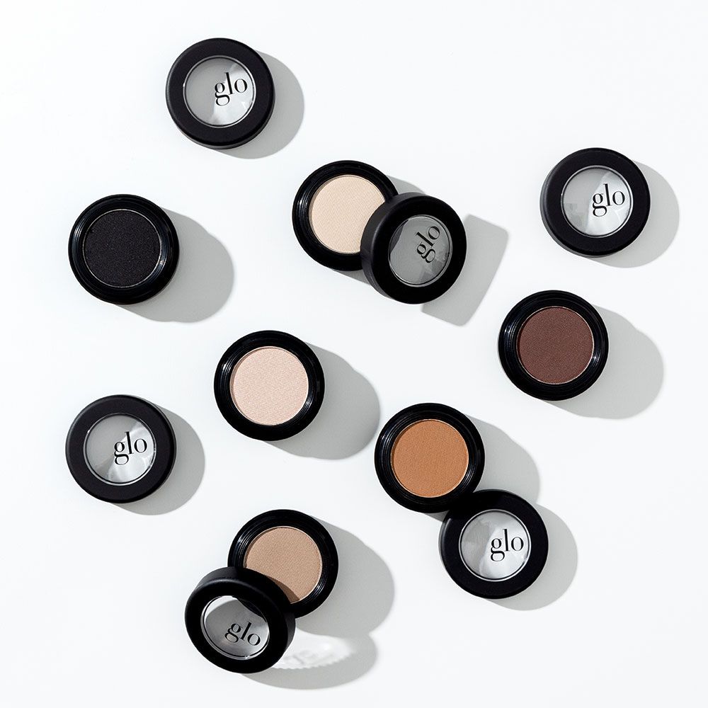 Velvety mineral eyeshadows in various shades for blending and customization, featuring high color payoff and all-day wear.