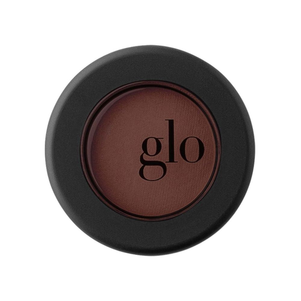 Velvety rich-pigment single mineral eyeshadow in dark brown shade by Glo, enriched with antioxidant protection for high color payoff.