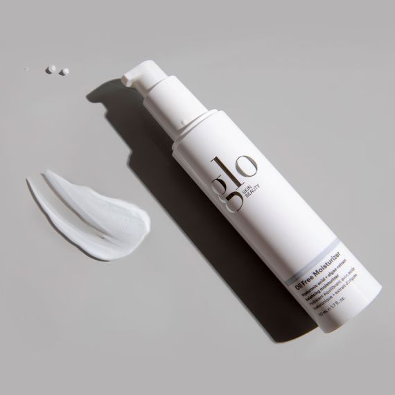 Oil Free Moisturizer by Glo Skin Beauty with algae extract and hyaluronic acid, ideal for oily and combination skin types, shown on a gray surface