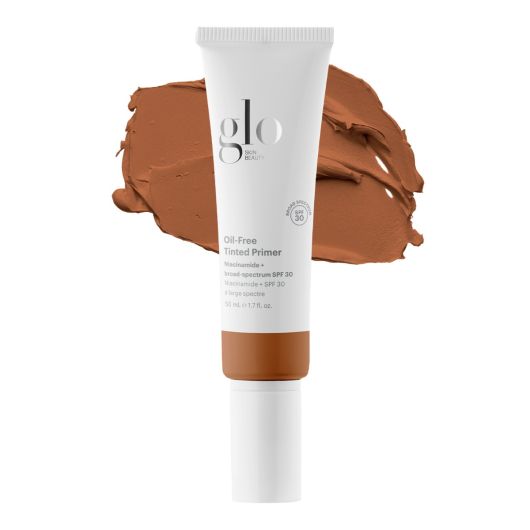 Oil-Free Tinted Primer SPF 30 in tube with sheer coverage, broad-spectrum sunscreen, and skin-balancing properties displayed against a color swatch.