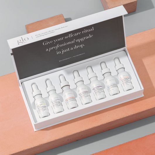 The Solutions Serum Set V2 featuring seven targeted skincare treatment serums in dropper format for personalized skin care solutions.