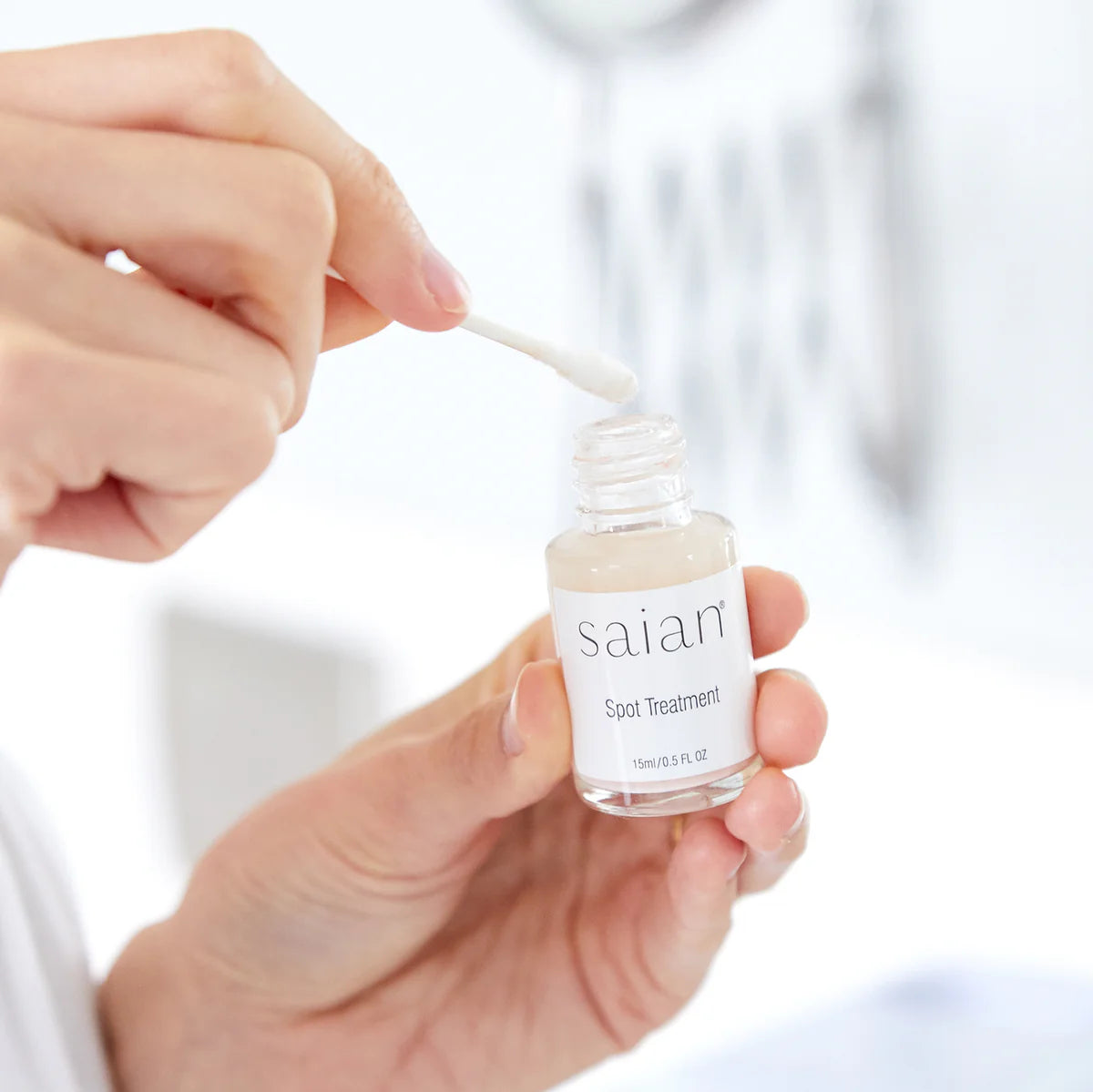 Blemish Spot Treatment by Saian being applied with a cotton swab for targeted blemish care.