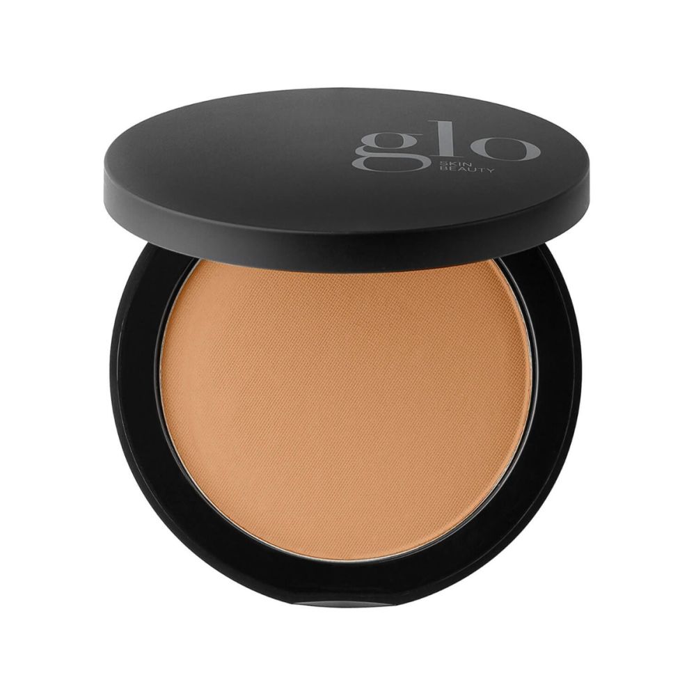 Pressed powder foundation in black compact, providing flexible, longwearing coverage with a natural, weightless finish.